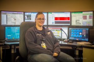 Brandi Greatbatch sits at her workstation for Mahaska County 911 Communications.