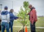 Michelle and Malcolm Turner help plant a tree in honor of their son, Marquis Todd on Saturday.