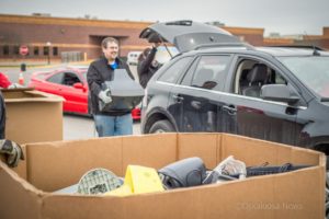 Eddie Pierson of Mahaska Communications Group helps unload e-waste from an area residents vehicle on Saturday morning.