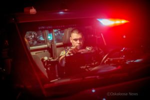 Oskaloosa Police Office Nick Landgrabe works a traffic stop in the city of Oskaloosa on Saturday night.