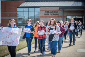 Students from Oskaloosa High School walk out on Friday, April 20, 2018 to remember those killed in school shootings.