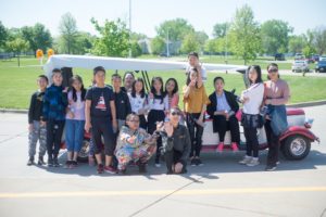 Elementary age students from China recently experienced Oskaloosa. They are seen here loading onto the MCRF trams for a tour.