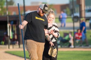 Chris Valster and his now fiancee Shyann Fleener walk off the field Thursday evening.