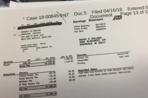 Mark Doland pay receipt as part of his Federal Bankruptcy filing listing his address as a Norwalk, Iowa address. (public document)