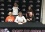 Jaden Van Roekel (center) signs with Wartburg Football. His mom Wendy (left) and father (Scott) right, along with OHS Head Football Coach Jake Jenkins (back left)