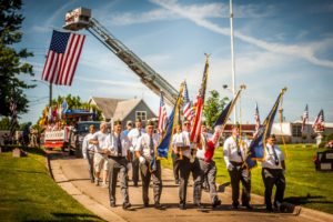 Veterans march into Forest Cemetery on Monday, May 28th, 2018 for Memorial Day.