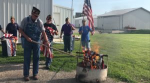 Veterans destroy retired U.S. Flags. (photo by Hailey Brown)