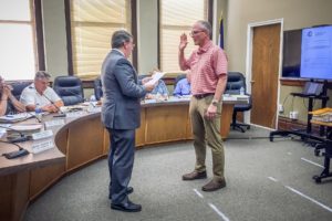 Bob Drost is sworn in by Mayor Dave Krutzfeldt as 2nd Ward City Council Member.