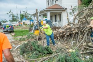 New Sharon Fire volunteers worked to clean up debris in front of the Marshalltown Salvation Army just days after an EF-3 tornado struck.