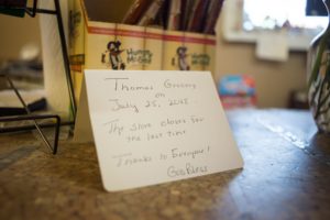 A note on the counter at Thomas Grocery says they will close for the final time on July 25, 2018. "Thanks to Everyone! God Bless"