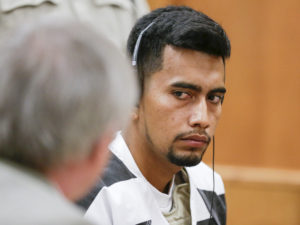 Cristhian Bahena Rivera, 24, looks to his attorney Allan Richards as he makes his initial appearance on a charge of first-degree murder during at the Poweshiek County Courthouse in Montezuma, Iowa, on Wednesday, Aug. 22, 2018. Rivera is accused of killing University of Iowa student Mollie Tibbetts. (Jim Slosiarek/The Gazette/Pool)