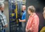 Customers tour the server room at MCG on Tuesday morning.