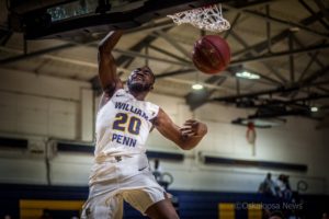 Demarius Cager puts home 2 easy points on Saturday for William Penn.