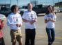 Carter Huyser, Mike Comfort, and Lauren Coon share some words before taking off to Fort Dodge and the state cross country meet.