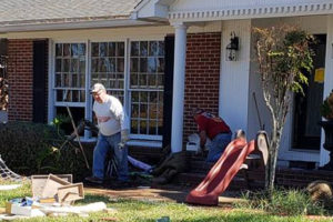 New Sharon Fire Captain Steve Gerard is seen here helping to clear debris from a home in Port St. Joe, Florida this week. (photo by Nancy Boney)