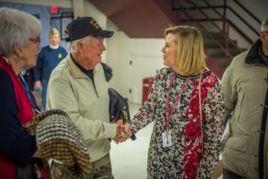 Oskaloosa School Superintendent Paula Wright thanks a veteran for their service after Monday's assembly.