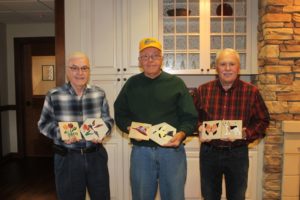 Mahaska Ruritan Club Members Larry Gordy, Club President Larry Lewis and Club Secretary Dave Figland show the beautiful ceramic tiles Lewis made and donated to the Hospice Serenity House on the Mahaska Health campus in Oskaloosa.  (submitted photo)