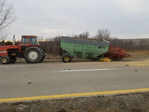 A tractor pulling two grain wagon's was struck by a delivery truck along Highway 163 on Friday afternoon. Photo by Patricia Williams Brainard.