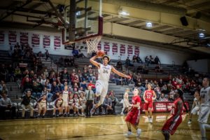 Junior Xavier Foster delivers 2 of 21 points against DCG on Friday night.