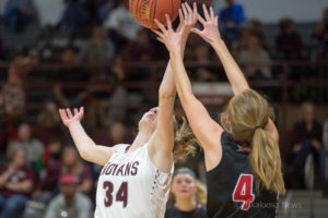 Ashley Drost battles under the rim against Newton on Friday night at home.