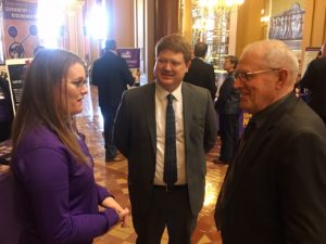 Rep Dustin Hite (middle) and Sen. Ken Rozenboom (right) at the capitol engaging in conversation with constituents.