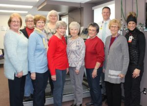 The Mahaska Health Hospital Auxiliary recently donated a new commercial grade rehabilitation treadmill for use in the cardiac rehabilitation portion of Mahaska Health cardiopulmonary services. Pictured with the treadmill from left to right are: Volunteer Coordinator Kim Langfitt; Auxiliary Board Members Carole Comstock, Sharon Palmer, Becke Arnold, Sherill Helm, Janet Masterson and Lorraine Blom; Mahaska Health CEO Kevin DeRonde; Auxiliary Board Member Judy Lewis; and Cardiac Rehab Nurse Renee Edgar 
