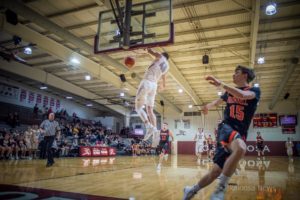 Making his momma mad, Cole Henry dunks the ball against Grinnell on Wednesday night.