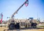 Members of Det 2 3654th Maintenance Company stand by their HEMTT A4 M984A4 Recovery Truck on Saturday as a way of reaching out to the Oskaloosa community.
