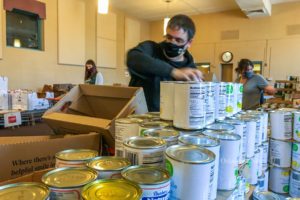 Eddie Pierson fills Christmas food baskets in preparation for the yearly distribution to families and individuals.