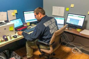 Josh Stevens helps at the COVID-19 call center inside Penn Central Mall.