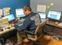 Josh Stevens helps at the COVID-19 call center inside Penn Central Mall.