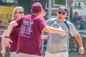 Oskaloosa Head Coach Jay Harms (right) with his wife Linda (left) just after winning a sate title.
