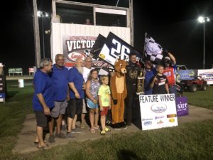 Jonathan Cornell and his team celebrate their win at Benton County Speedway Sunday 
