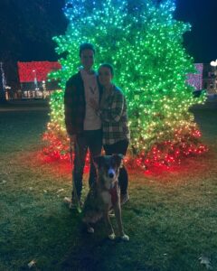 Byron Yoder and Aubrey Fay pose with the downtown lights in Oskaloosa after becoming engaged.
