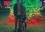 Byron Yoder and Aubrey Fay pose with the downtown lights in Oskaloosa after becoming engaged.