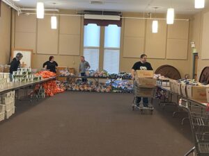 Volunteers help prepare the Christmas food boxes for the 2021 distribution. (submitted photo)