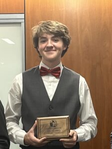 Elliot Nelson. He qualified for the top house at state debate, ultimately ranking 4th.