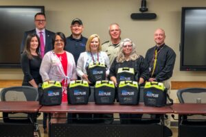 Representatives from Mahaska Health, Mahaska County Emergency Management, Mahaska County Sheriff's Office presented the Oskaloosa School District with AEDs.