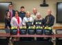 Representatives from Mahaska Health, Mahaska County Emergency Management, Mahaska County Sheriff's Office presented the Oskaloosa School District with AEDs.