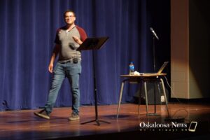 Dave Baker with the 29th State shared Mahaska County history on Friday evening at George Daily Auditorium.