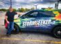 Brandon Copic next to his storm chase vehicle as he staged for severe weather in Oskaloosa, Iowa.