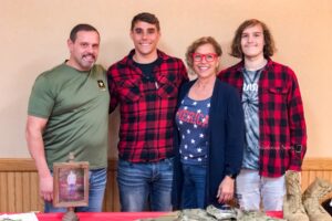 Andrew O'Day (tall middle male) with his family on Sunday as he said good-bye to the Oskaloosa community.