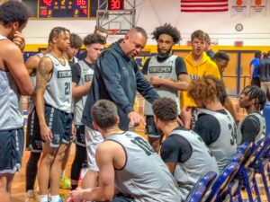 William Penn Men's Basketball Head Coach John Henry gives some last minute instruction during the teams second scrimmage of the year.