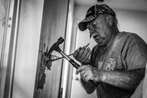 New Sharon fire captain Steve Gerard works on a home in North Ft. Meyers Florida this week.