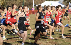North Mahaska’s cross country team battled with 150 runners for a chance for a medal at the state cross country meet. In red from left, Ben Yang, Lane Harmon, Nate Sampson, Brayden Veiseth and Asher DeBoef head out in the opening moments of the race. 
