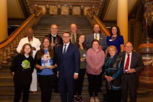 Paula Falconer (back left) was honored as one of Iowa's top volunteers and mentors at our annual Volunteer Iowa awards ceremony at the Iowa State Capitol. (submitted photo)
