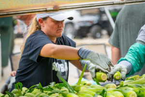 Jodi Steinlage volunteered at Sweet Corn Serenade, helping keep the roasted sweet corn ready to eat.