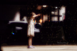 A young girl plays in the bubbles during the final selections of the Oskaloosa City Band concert of 2023.