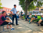 Iowa Auditor Rob Sand talks with community members on the Oskaloosa Square this past week.