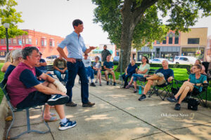 Iowa Auditor Rob Sand talks with community members on the Oskaloosa Square this past week.
